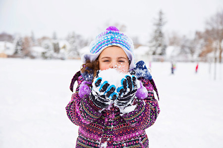 St. Ambrose student with snowball